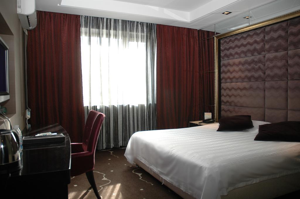 Harbin Yakelai Holiday Hotel Номер фото