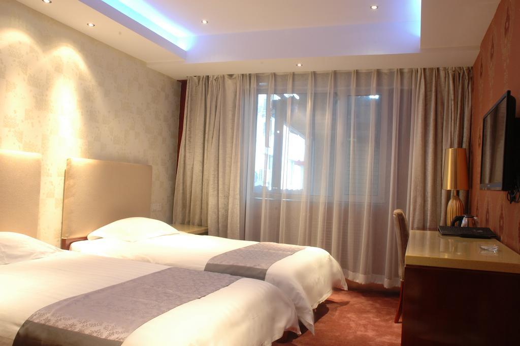 Harbin Yakelai Holiday Hotel Номер фото