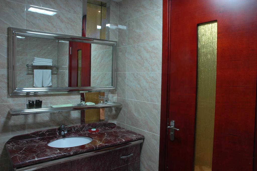 Harbin Yakelai Holiday Hotel Номер фото
