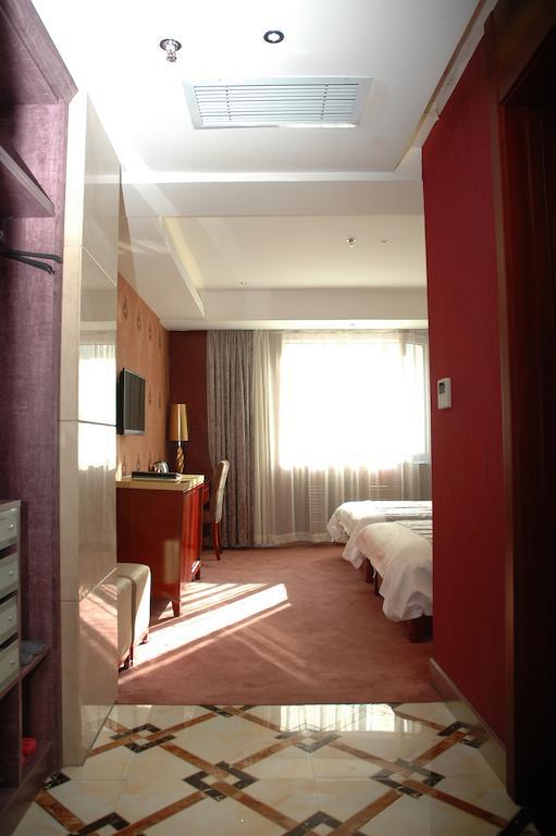 Harbin Yakelai Holiday Hotel Номер фото