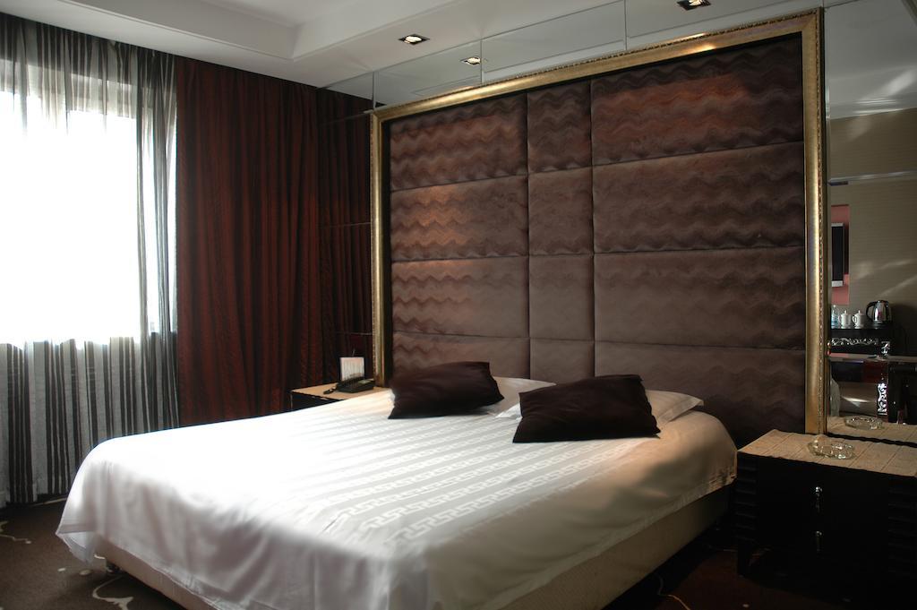 Harbin Yakelai Holiday Hotel Номер фото
