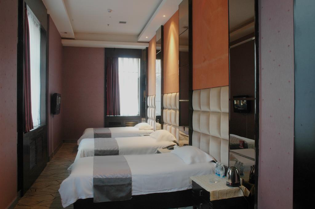Harbin Yakelai Holiday Hotel Номер фото