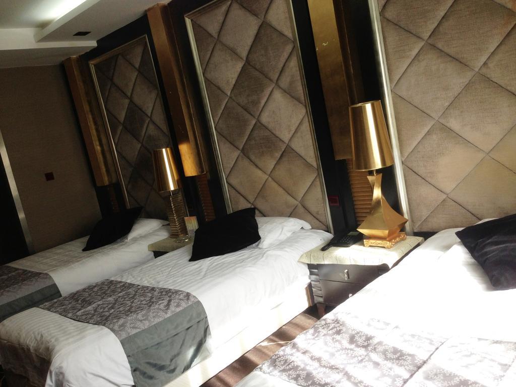Harbin Yakelai Holiday Hotel Номер фото