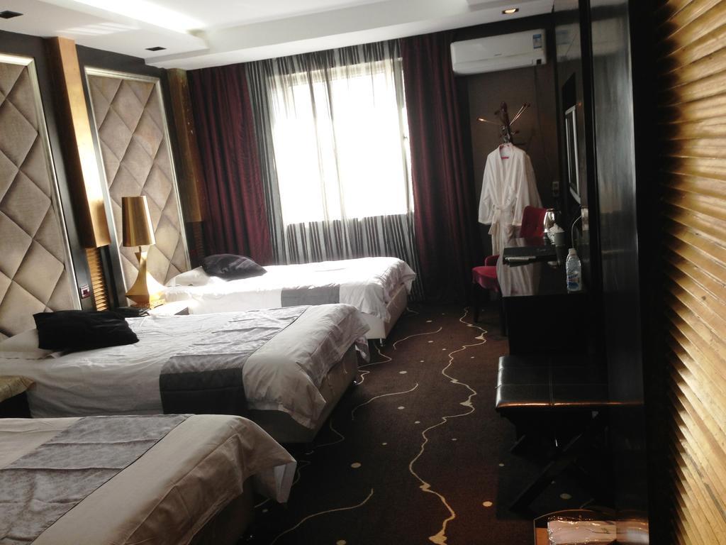Harbin Yakelai Holiday Hotel Номер фото
