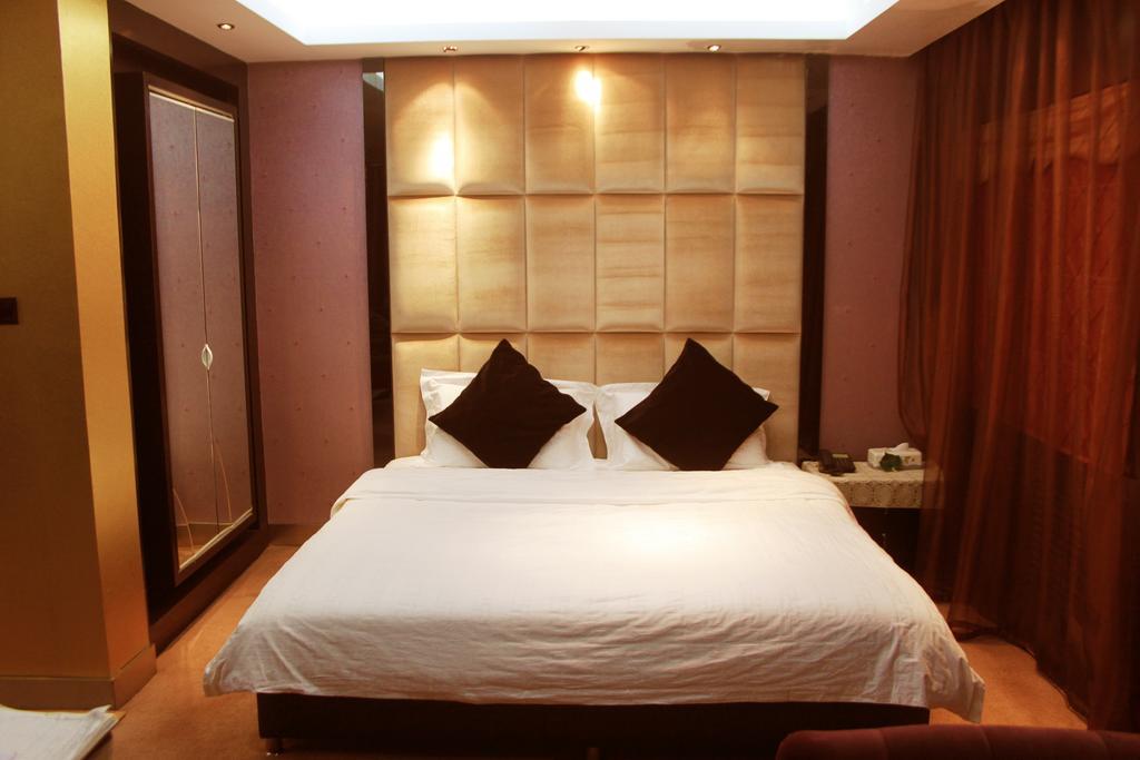 Harbin Yakelai Holiday Hotel Номер фото