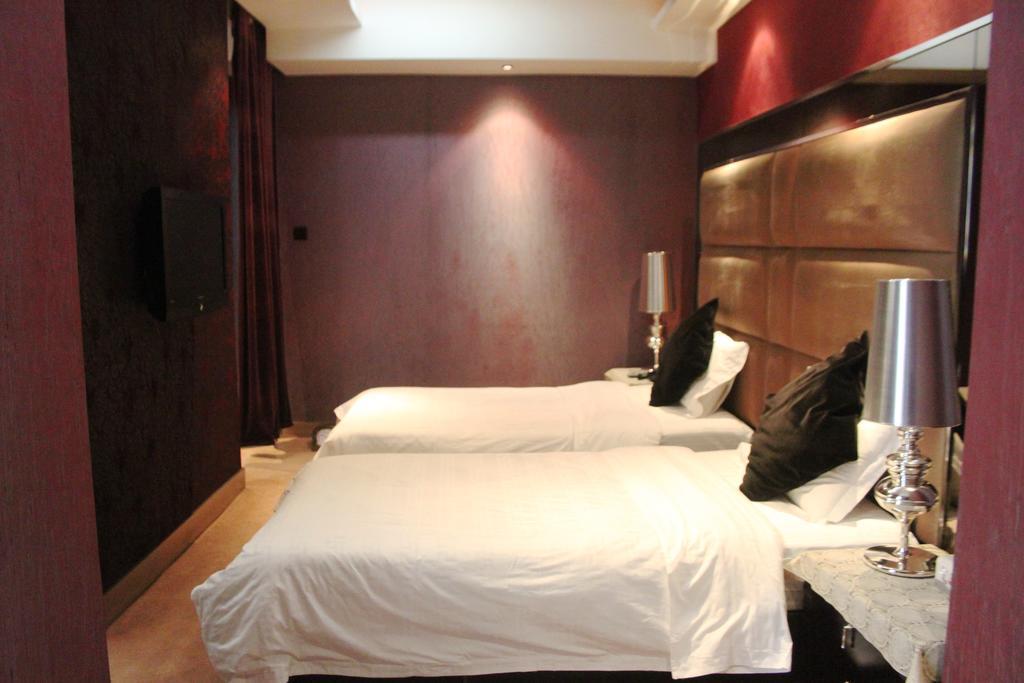 Harbin Yakelai Holiday Hotel Номер фото